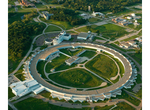Aerial photograph of a ring-shaped synchrotron facility